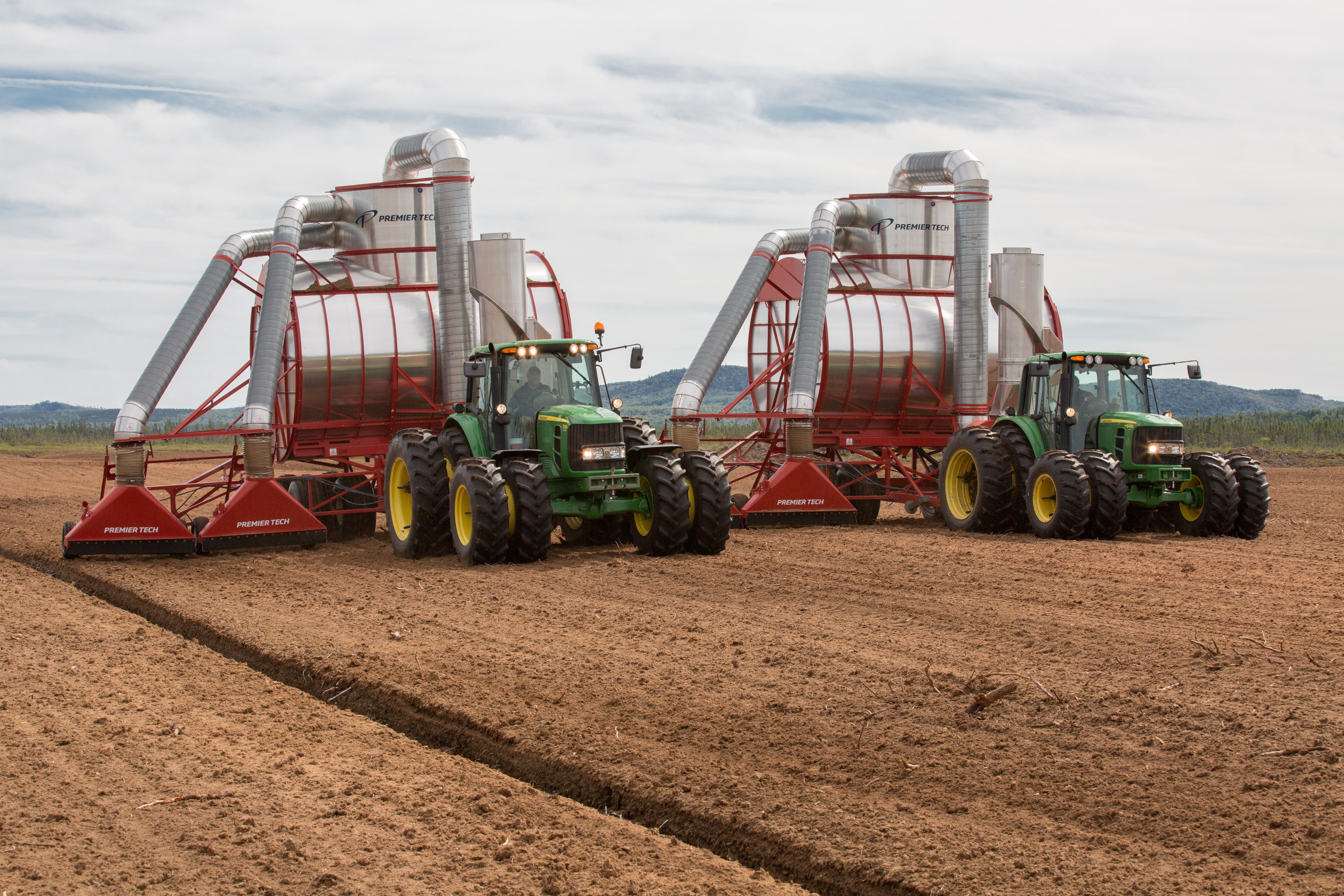 An impressive collection of heavy-duty farming machinery at work